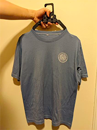: The 3 images show how the new assistive hanger expands and holds 3 types of cloth, M-size grey T-shirt, long-sleeve navy blue blouse, and M-size ¾ Relaco pants.